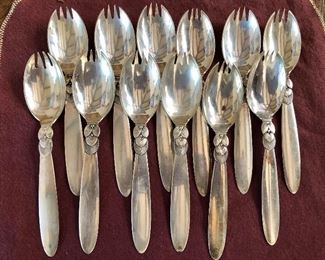 $850  Set of 12 Georg Jensen Cactus pattern sterling silver ice cream forks.  Each 6" L.