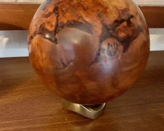 $95  Carved wood ball on stand (1 of 2).   Approx 4.5" diam.