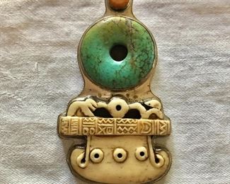 $150  Large pendant with turquoise center.   4"H; 2.4"W 