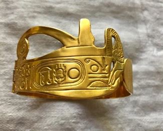 $25 Gold tone geometric design cuff bracelet.  2.5"diam.  2"H 
