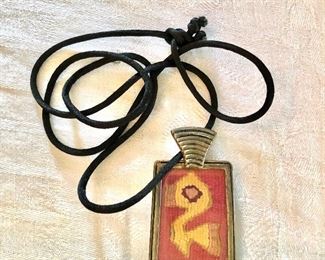 $45 Vintage textile on cord pendant.   String: 29"L.  Pendant:  2.5"L; 1.5"W 