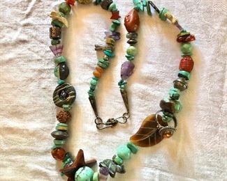 $175 Stone beaded necklace with amber ring !   29"L 