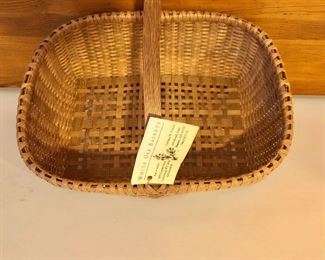 $75 Woven basket with handle and label. #8    9.5" H, 15" L, 12" W.  