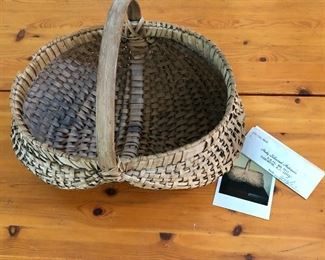$120  Woven basket with handle and receipt #4  (as is, minor damage on rim).   10" H, 12" L, 10" W.  
