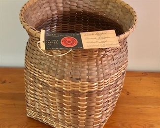 $50 Woven basket with tag.  12" H, 10.75" diam.  