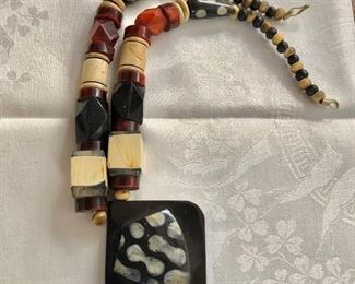 $30 Chunky wood and hard plastic necklace 26" Long 