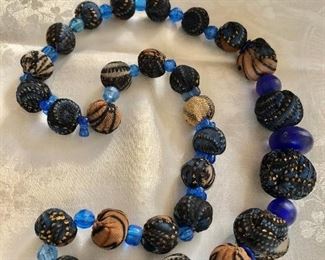 $22 Cloth and plastic colorful blues necklace 24" L 