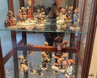 Great looking Curio Cabinet full of Hummels