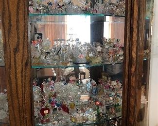 China Cabinet Filled with Blown Glass Figurines