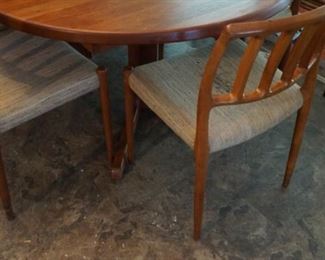 Mid-Century table By CJ Rosegaarden and 6 Danish Teak Mid-Century Niels Moller chairs model #83,  one chair has a stain on the fabric. These are a must-see!!!! Chairs need to be reupholstered   in our opinion