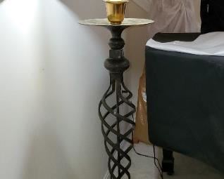 Cast iron "swirl" floor lamp with oiled parchment shade, 6' tall