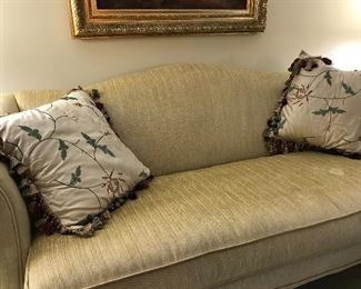 Upholstered camel back love seat