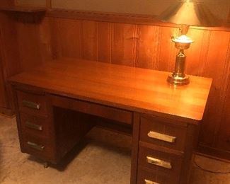 mid-century modern desk and brass lamp