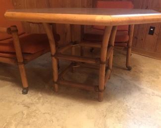 Rattan game table with 4 chairs on casters