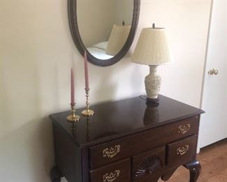 Nightstand, oval mirror, lamp and brass candelholders