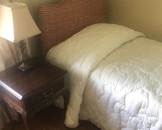 upholstered headboard and twin bed, nightstand and lamp