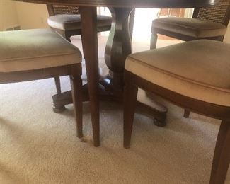 The base pedestal on the dining table and chair legs - simple clean styling