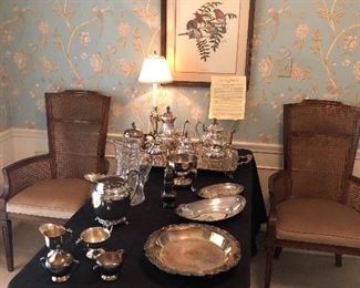 Came back arm chairs with dining table, framed bird print, another view of silverplate items