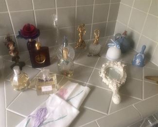 Collection of perfume spray bottles and perfumes
