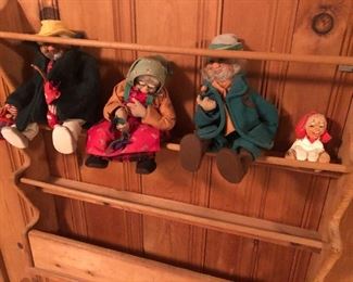 Wood wall mounted magazine rack… And a collection of vintage dolls