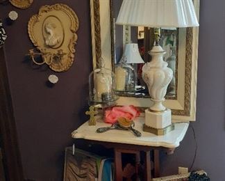 Antique marble-top table, mirror and suitcases