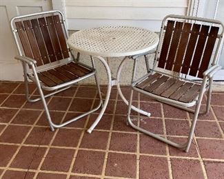 #89		27 Round x 29 Tall plastic table with 2 folding chairs	 $ 25.00 