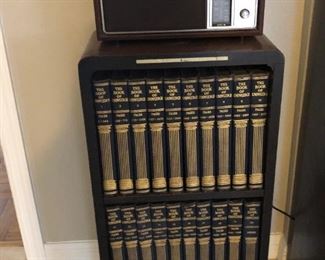 little bookcase with old books and old radio