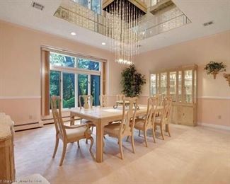 Classic Drexel Heritage "Corinthian" collection dining room set, olive burl and ash wood.   Set includes extendable table with 3 leaves, 2 arm chairs, 8 side chairs, sideboard buffet and lighted china cabinet.  