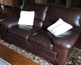2- matching Leather Loveseats in Living Room