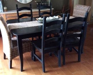Farm House dining table with wicker accent chairs