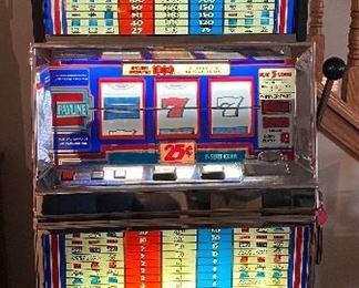 Fantastic Red, White and Blue Slot Machine for hours of home entertainment.  Works great! Takes quarters