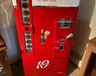Absolutely Fantastic Vintage Ten Cent Coca-Cola Bottle Vending Machine/Cooler. In excellent condition.

Model H81A. Serial number H503 1260         Measures about 27" w x 58.5" h and 16" d 