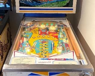D. Gottlieb Co Surf Champ Pinball Machine with manual and key. Manufactured in 1976.

Fun bright colored graphics, great sound and hours of entertainment! 