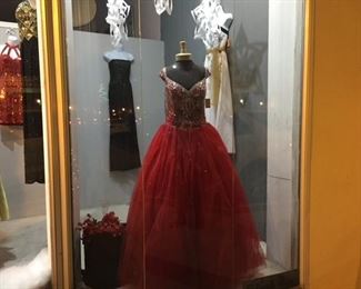 Magnificent quinceanera gowns.
Dramatic prom gowns.
Dance dresses, Christmas sequins, New Year’s Eve party dresses, body con dresses. 
All dresses are just $10 and at this super low store-closing price there are no try on’s and all sales are final with no returns or exchanges.
A seamstress can make adjustments for you.
Mannequins, dress forms, display items, jewelry and artwork liquidating too. 