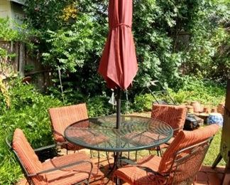 Patio table and chairs with umbrella