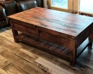rustic coffee table, it has a washed out red tint