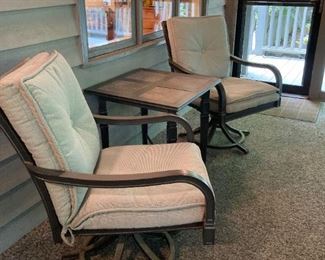 PAIR OF MATCHING SWIVEL ARM CHAIRS WITH SIDE TABLE