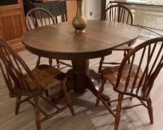OAK PEDESTAL TABLE WITH CLAW FOOT BASE, AND FOUR BARREL BACK CHAIRS