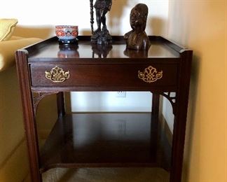 Chinese Chippendale table. One drawer with brass drawer pulls, carved fretwork detail. Bottom display shelf.