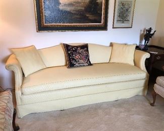 Pale yellow corded Sheridan style upholstered sofa.