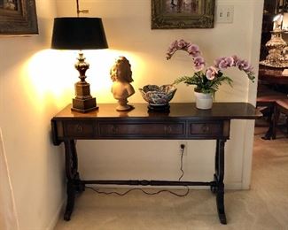 Baker Banded Mahogany dropleaf table. Banded top and drawer fronts. Two dovetail drawers, two dropleaf extensions, solid brass hardware, lyre base ends, turned stretchers.