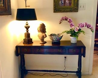 Baker Banded Mahogany dropleaf table. Banded top and drawer fronts. Two dovetail drawers, two dropleaf extensions, solid brass hardware, lyre base ends, turned stretchers.