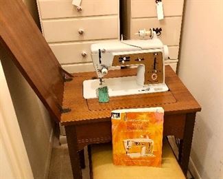 Vintage Singer Touch & Sew Deluxe zigzag sewing machine. Model 620. Machine, cabinet, and stool. Works great. Has instruction manual.

Tall seven drawer cabinet. Pair of three drawer side tables.