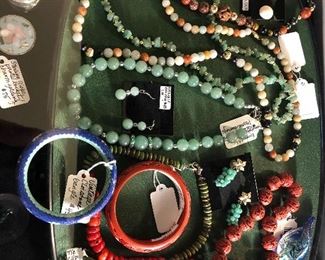 Coral, Jade, cinnabar, cloisonné. 