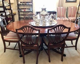 Drexel New Travis Court collection Hepplewhite Table with three 12” leaves and six upholstered shield back chairs.