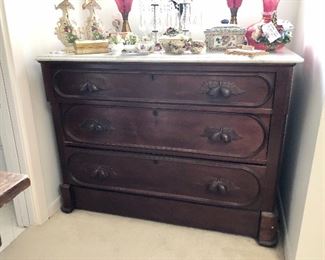 Buckley &  Bancroft Boston Massachusetts. Carved walnut, marble top, three drawer chest. Victorian late 1800s