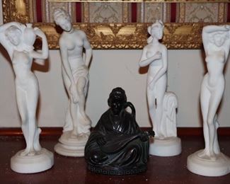White nude figures and an Asian sculpture