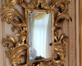 Italian Carved Giltwood Mirror with scrolling leaf tips