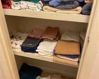 Towels, hand towels & wash cloths - good condition; items on floor of closet are rags