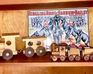 Wooden toy trains, reproduction Ringling Bros metal sign